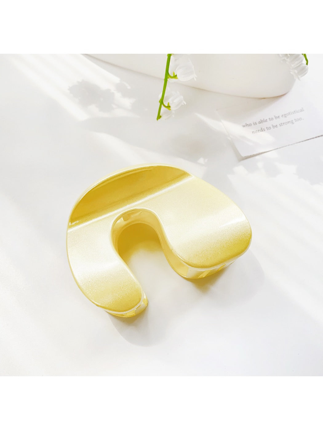 Beau solid color hair claw clip angled to show arch and clasp design