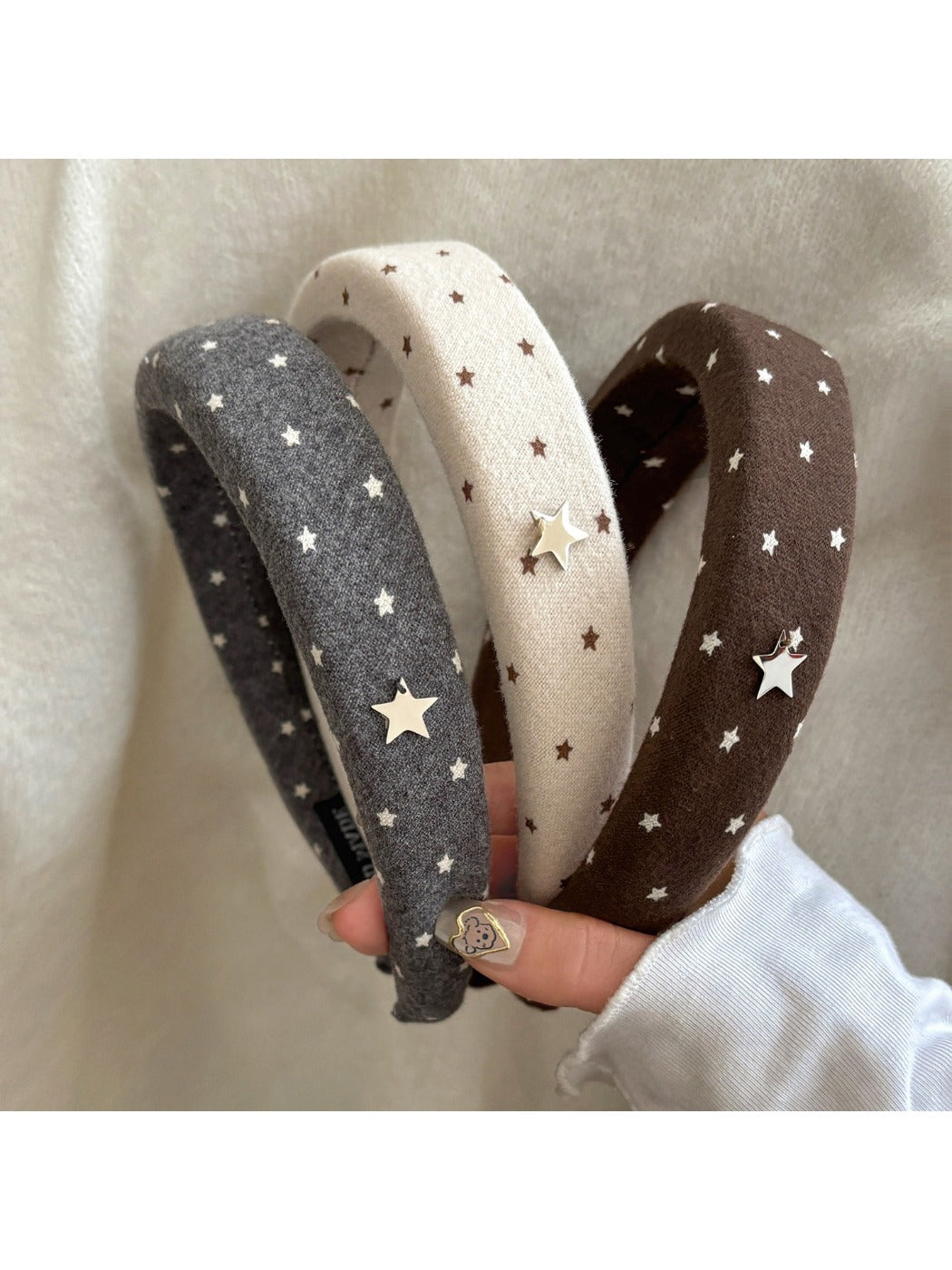 Close-up of a solid color star hairband with a stylish design on a white background