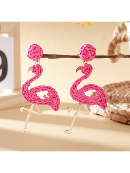 Side view of pink flamingo pendant earrings with detailed design