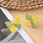 Earedge butterfly shaped drop earrings in a gift box with soft padding