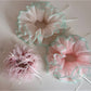 Close-up of Gifty Ribbon Knot Tulle Scrunchie in soft pink on white background