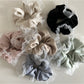 Close-up of Gifty vintage tulle ruffle scrunchie in soft pink fabric