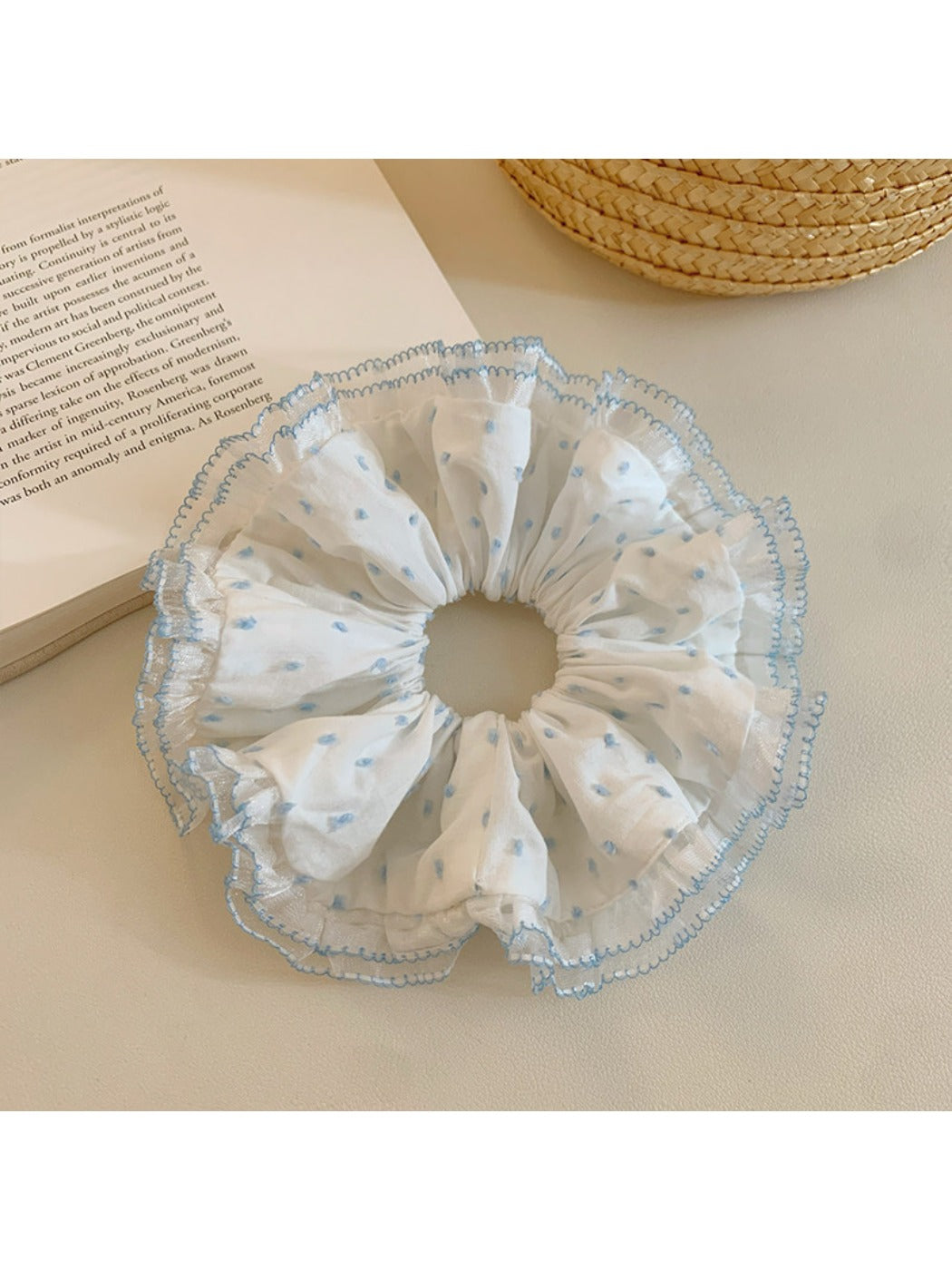 Scrunchie displayed on a white background highlighting ruffled design