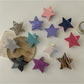 Beau five point star shaped claw clip in glossy black plastic