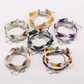 Close-up of Lovra boho stackable beaded bracelets in earthy tones on a wrist