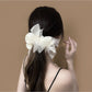 Gifty scrunchie with bow detail displayed on a white background