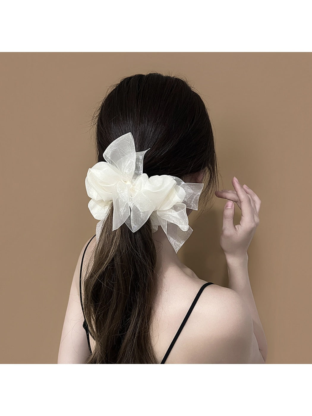 Gifty scrunchie with bow detail displayed on a white background
