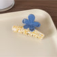 Beau Half Moon Flower Hair Claw Clip from top angle showing flower pattern and clip teeth