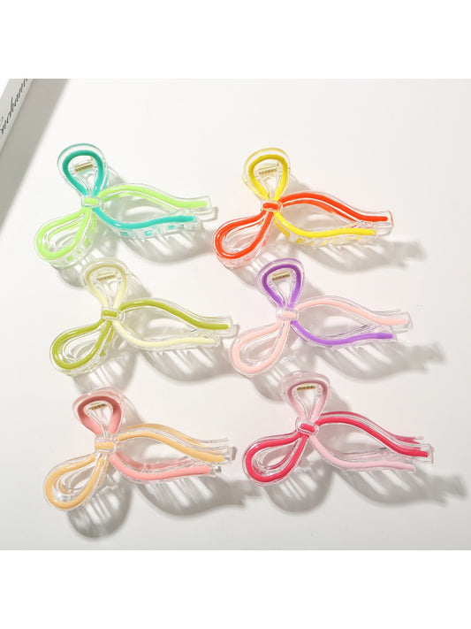 Beau Sweet Ribbon Knot Hair Clip in soft pink fabric with a knotted bow design
