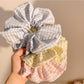 Close-up of Gifty Lazy Style textured scrunchie in soft pastel color