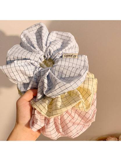 Close-up of Gifty Lazy Style textured scrunchie in soft pastel color
