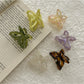 Close-up of Beau butterfly claw clip showing acetate material and butterfly shape