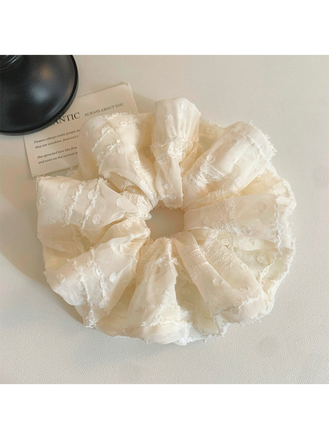 Ruffled scrunchie displayed alongside matching hair accessories