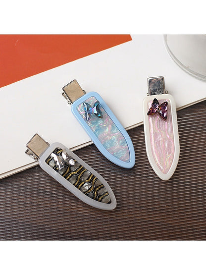 Side view of Beau oval butterfly hair clip highlighting clip mechanism