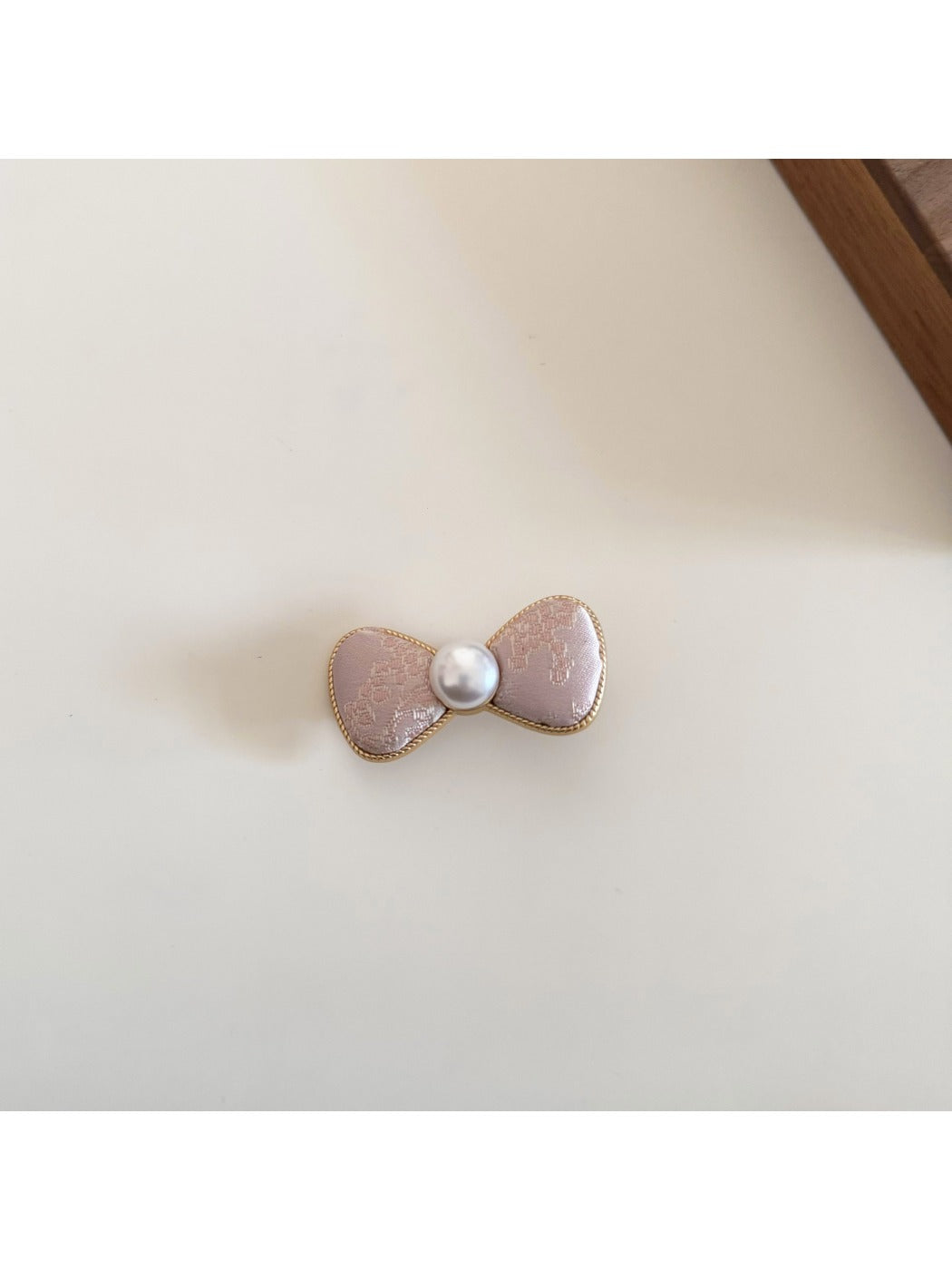 Beau bow hair clip in pastel pink with a metal clip backing