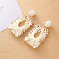 Model wearing Earedge raffia square shape drop earrings with casual outfit