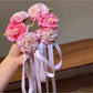 Close-up of Beau Sweet Lifelike Flower Ribbon Hair Clip showing detailed flower petals