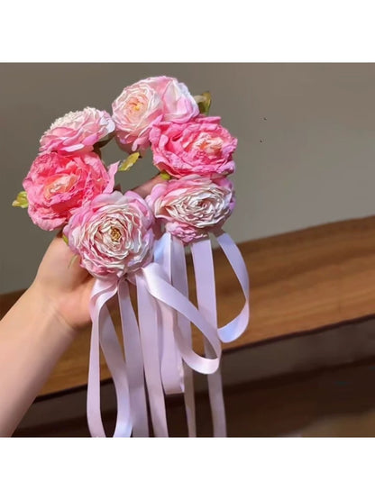 Close-up of Beau Sweet Lifelike Flower Ribbon Hair Clip showing detailed flower petals