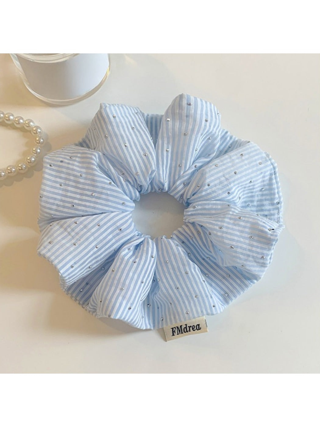 Model wearing Gifty solid color striped scrunchie styled with casual outfit