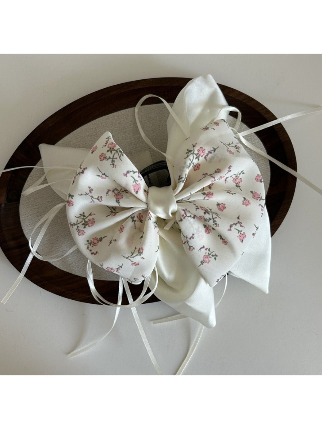 Beau Sweet Tiny Floral Bow Claw Clip clipped in hair with floral design visible