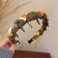 Model styling Gifty knitted fabric wrapped headband with loose hair