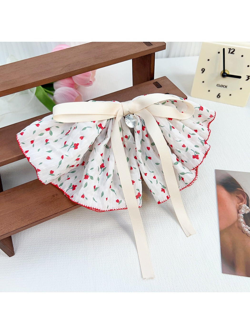 Model wearing Beau Chic Sweet Bow Hair Clip with loose waves and casual outfit