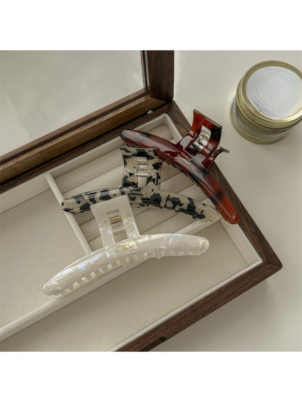 Close-up of Beau acetate claw clip showing smooth glossy finish and curved design