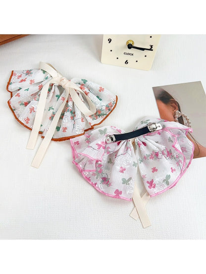 Side view of Beau Chic Sweet Bow Hair Clip highlighting clip mechanism and bow shape