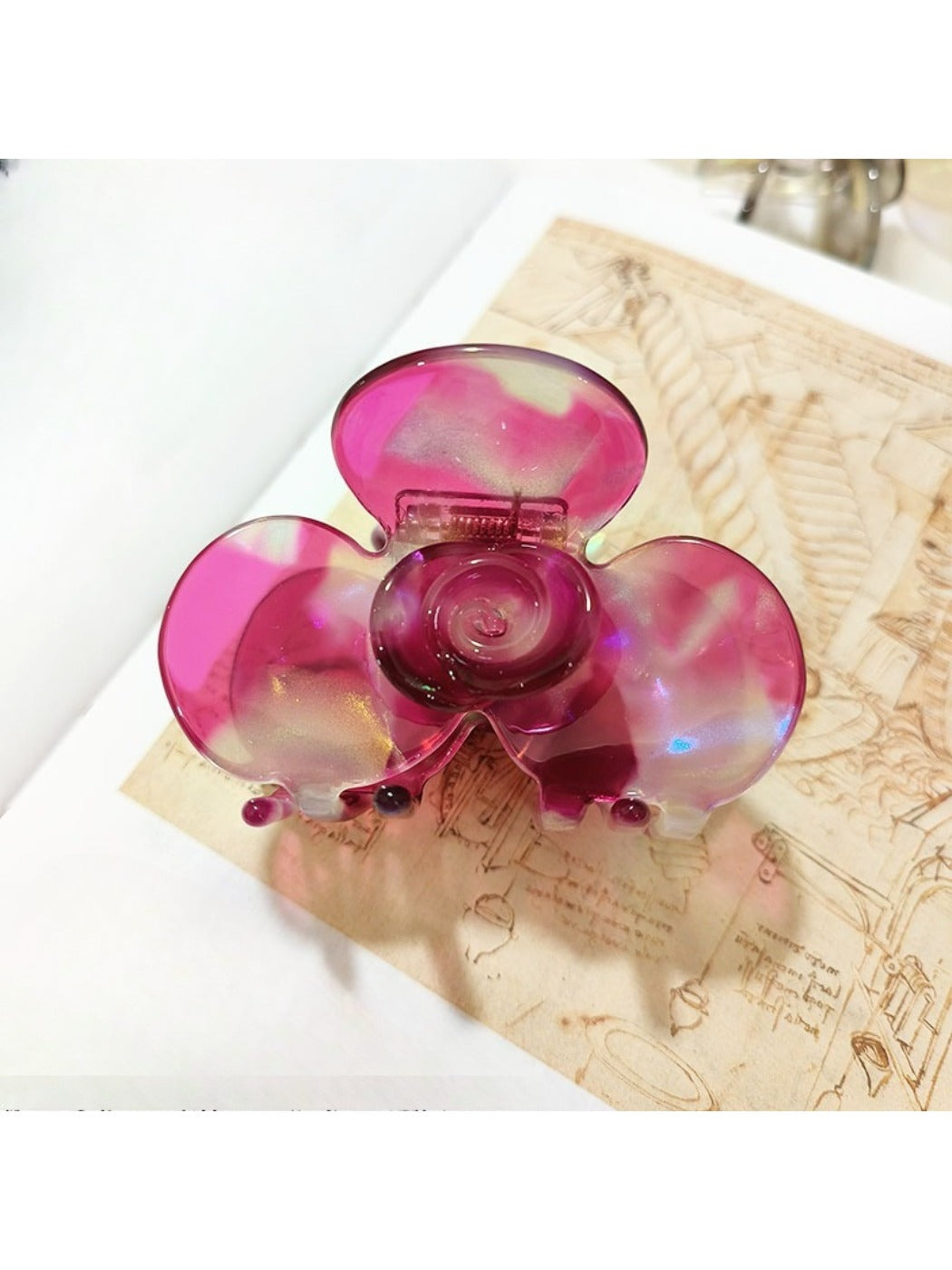 Beau Sweet Acetate Medium Flower Claw Clip open to display inner clasp mechanism