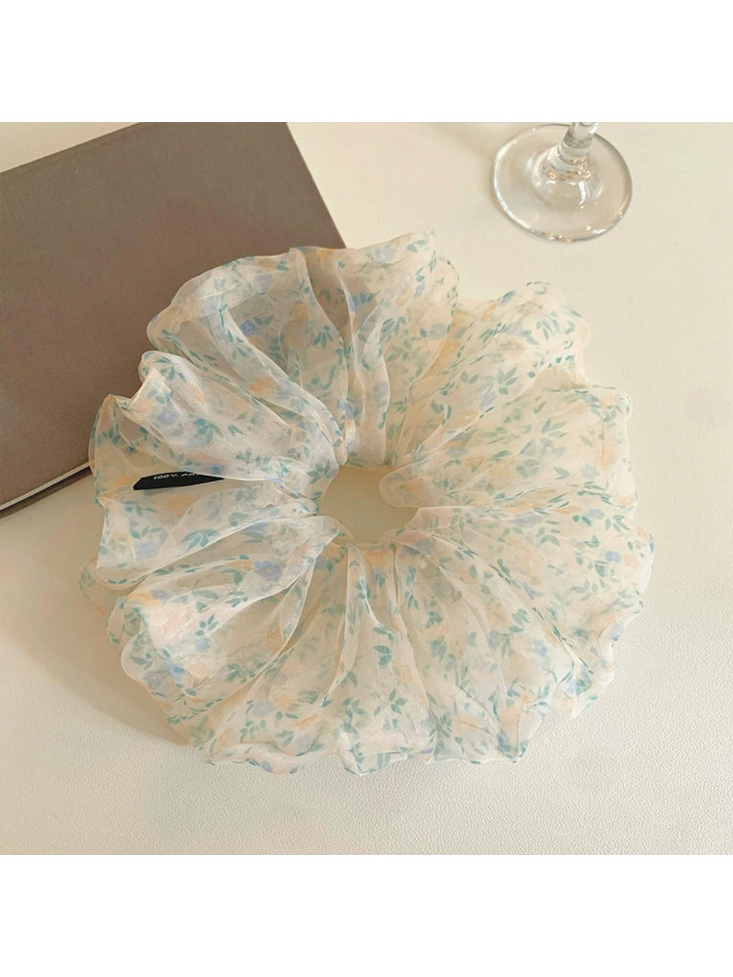 Large green tulle scrunchie with tiny white and pink floral pattern