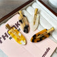 Close-up of Beau acetate invisible hair clip highlighting smooth curved edges