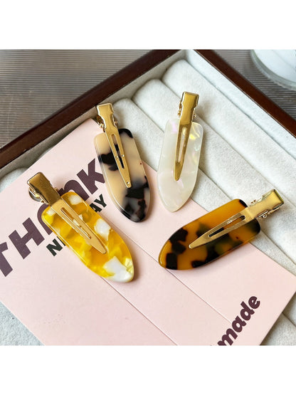 Close-up of Beau acetate invisible hair clip highlighting smooth curved edges