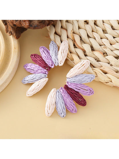 Earedge fan-shaped earrings laid flat showing full shape and color pattern