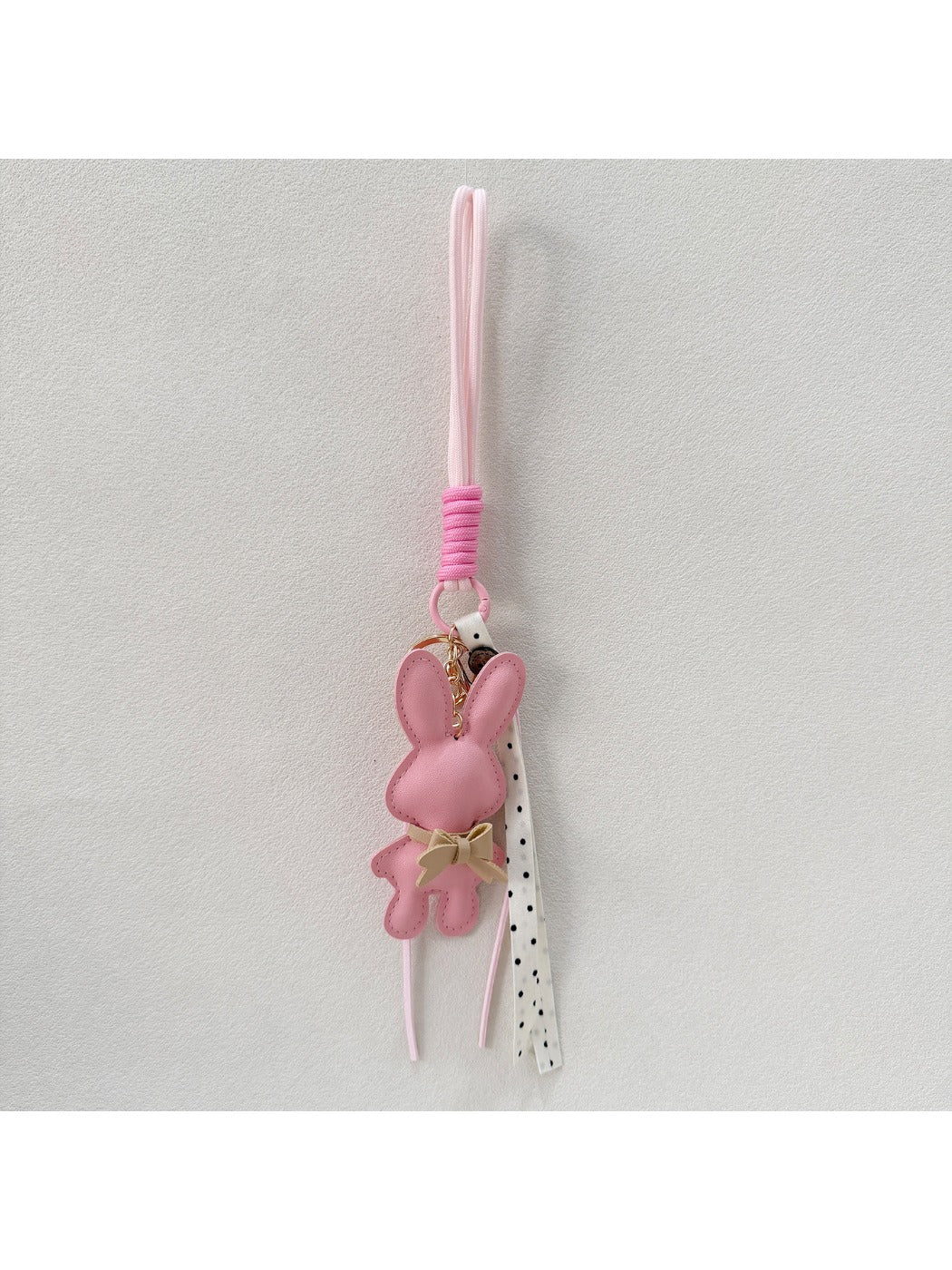 Back view of cartoon bunny keychain with smooth surface