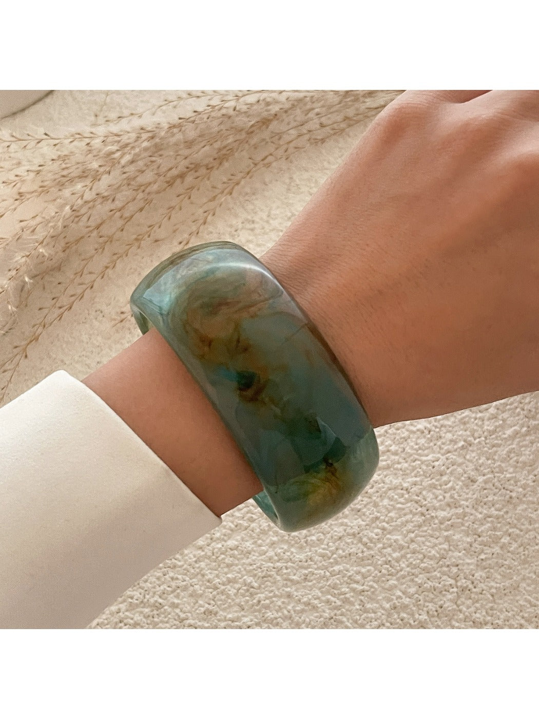 Lovra vintage minimalist round bangle bracelet paired with other delicate gold jewelry