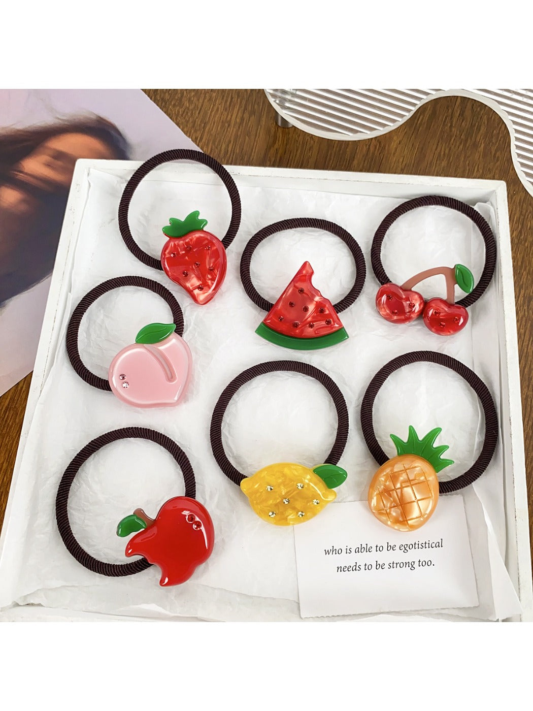 Set of colorful hair ties decorated with cute fruit charms including strawberries and oranges