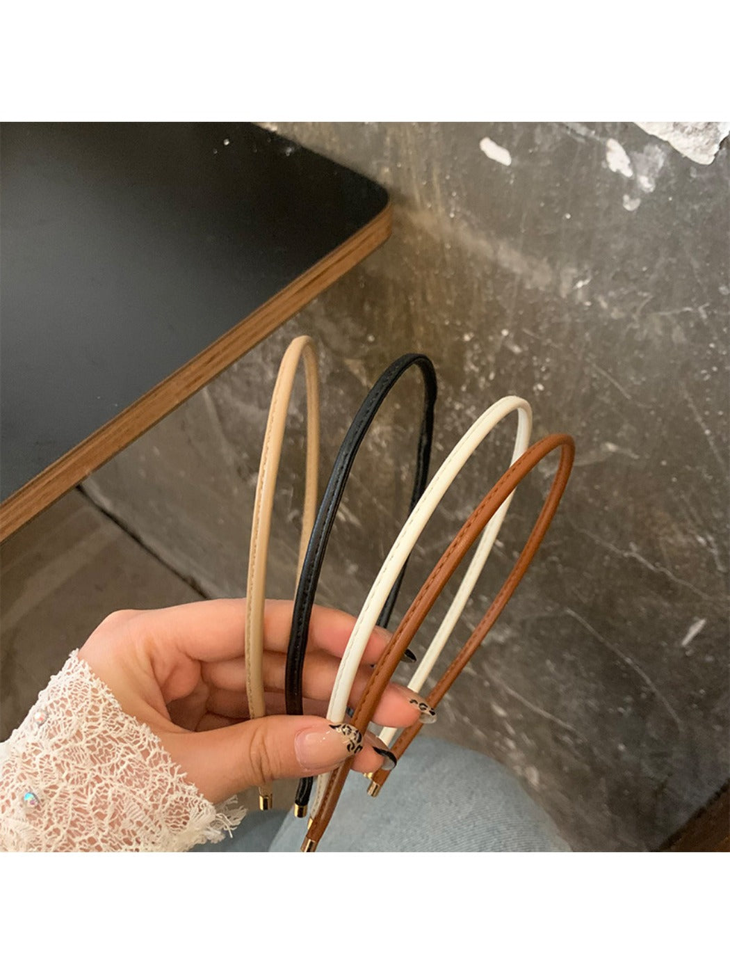 Side view of Gifty minimalist headband in muted beige tone