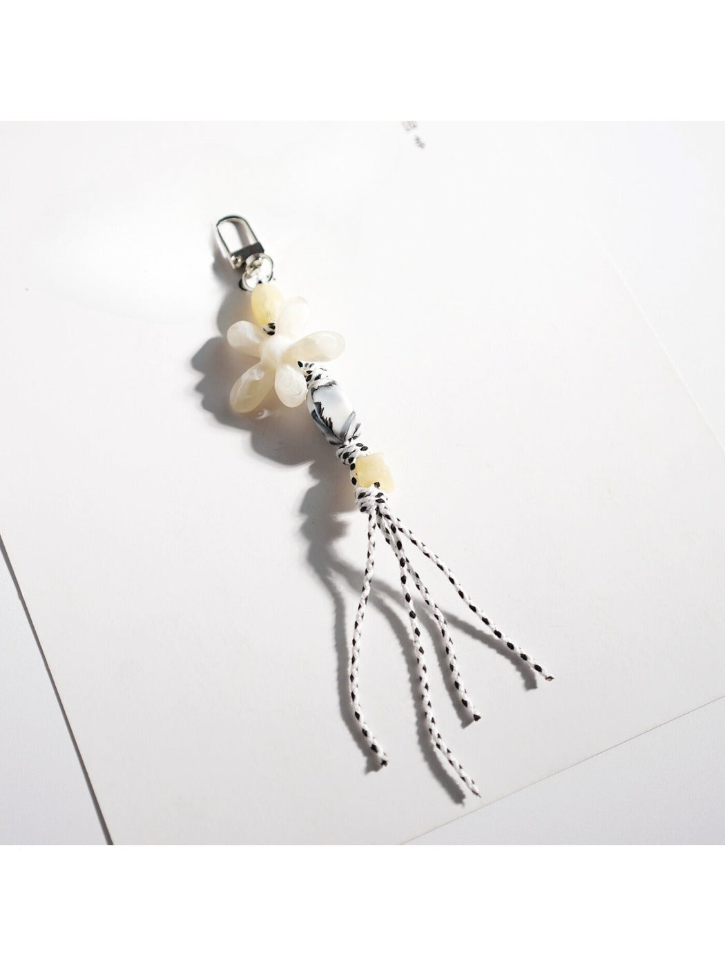 Keypus acrylic beaded flower keychain attached to a set of keys