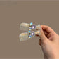 Beau comb-shaped hair clip holding hair in place, showcasing its size and design