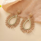 Earedge raffia teardrop hollow earrings displayed on beige fabric background
