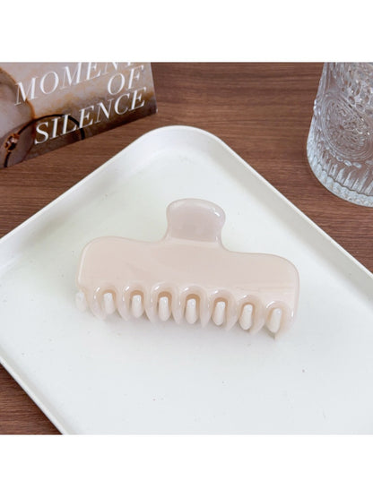 Beau square hair claw clip displayed on a wooden surface