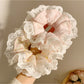 Flat lay of Gifty sweet and charming printed scrunchie on white background