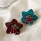 Beau star shaped hair claw clip in pastel pink on white background