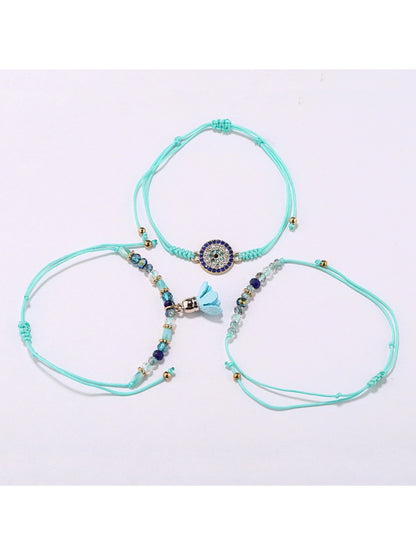 Lovra small bead tassel alloy bracelet displayed flat showing detailed beads and tassel