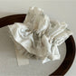 Gifty Sweet Lace Tiny Floral Scrunchie paired with casual outfit for a feminine look