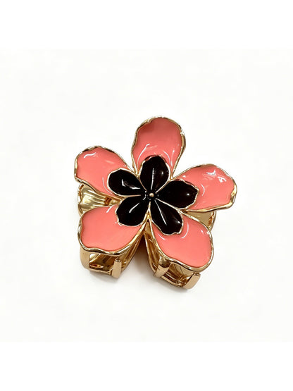 Top view of Beau lively sunny flower hair clip highlighting detailed petals and center