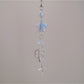 Back view of iridescent star keychain showing smooth surface