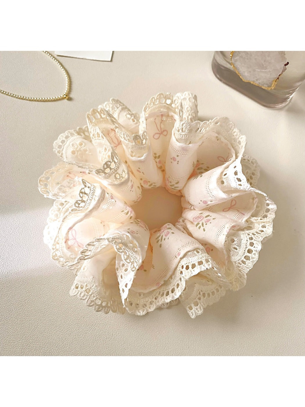 Gifty Sweet Bow Print Ruffled Scrunchie styled in hair with visible pink bow print and ruffles