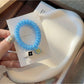 Gifty - Plastic Flower Bead Spiral Hair Tie