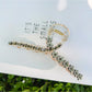 Beau elegant floral cross hair claw clip next to matching floral accessories